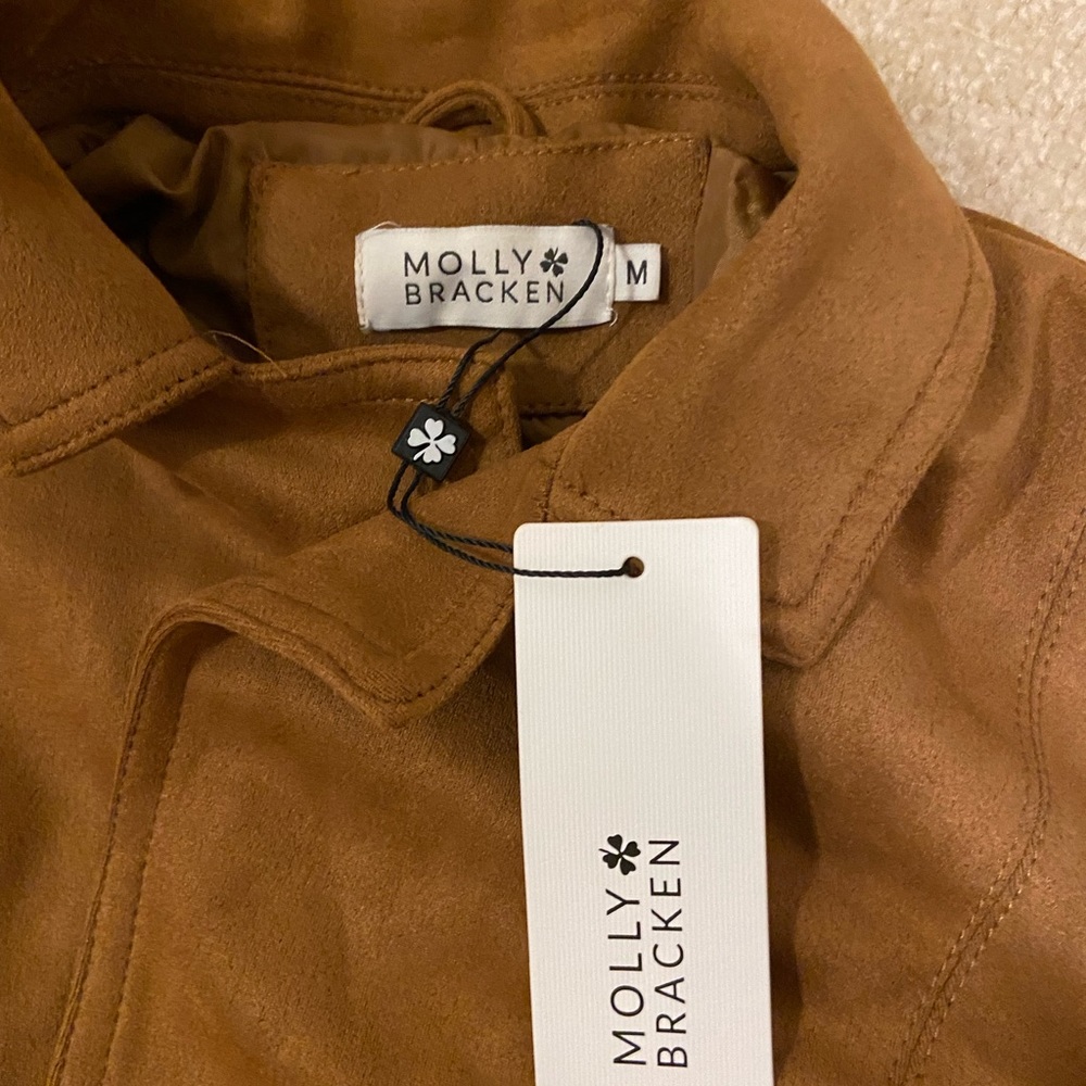 Molly Bracken, Size Medium, Camel cinched waist jacket.